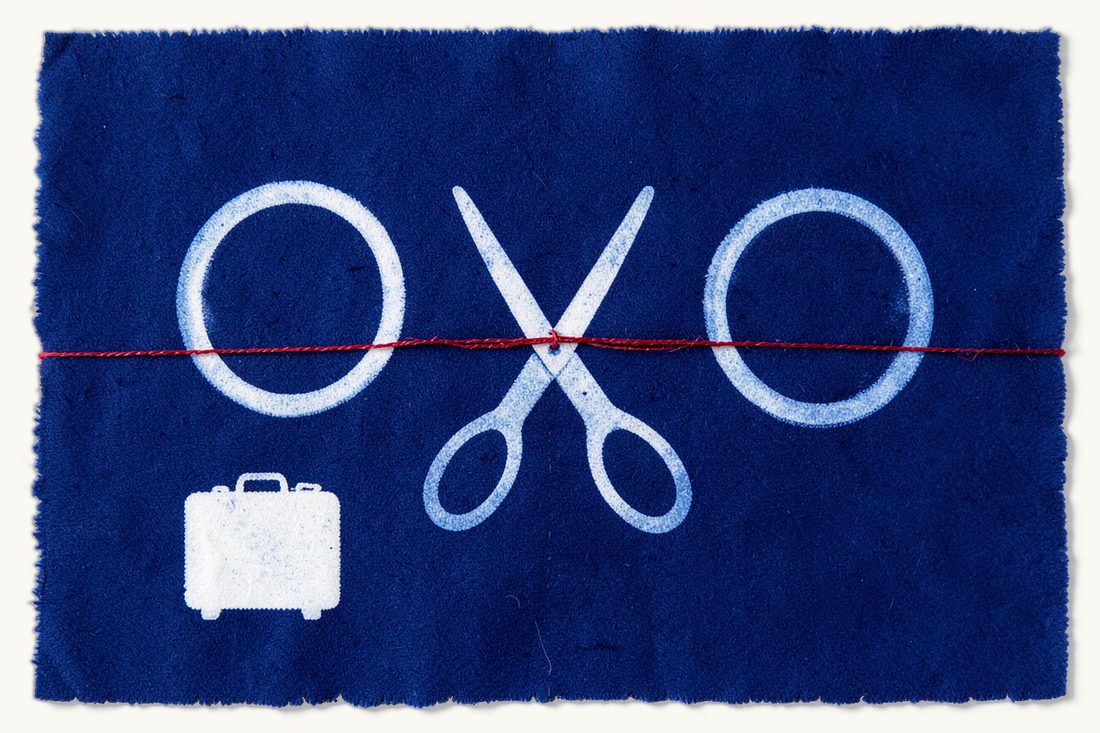 How divorce in Turkey works for foreigners: two wedding rings set apart, a red thread cut between them by open scissors, a small suitcase beside them, cyanotype print