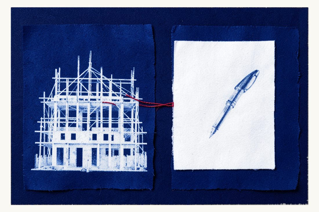 Works contract for building a structure: a large building under scaffolding tied by a red thread to a blank sheet of paper with a fountain pen lying on it, cyanotype print
