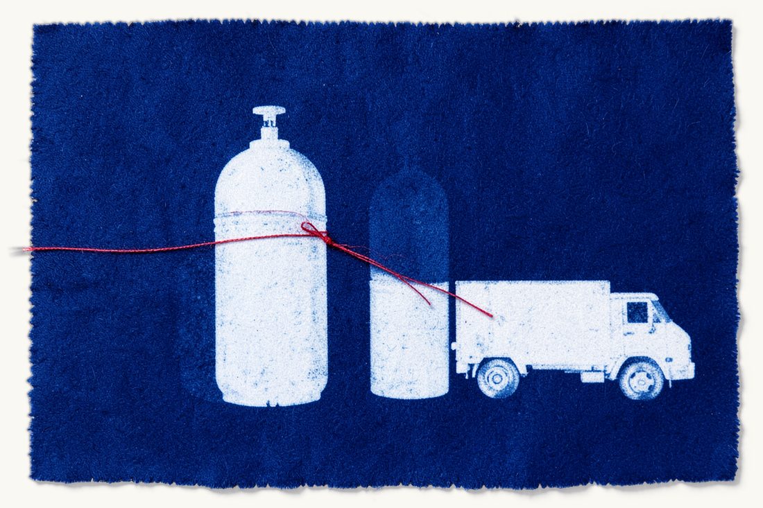 LPG, autogas and bottled gas licensing: two gas cylinders of different heights joined by a red thread to a delivery truck, cyanotype print