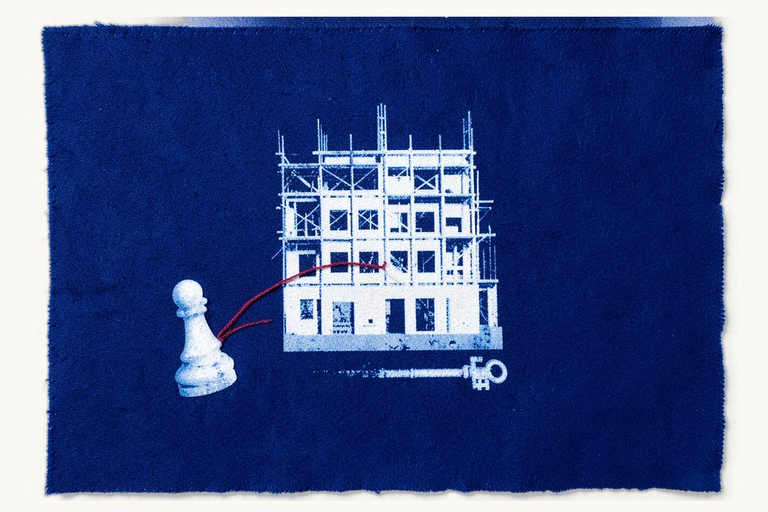 Risks for the landowner in a flat-for-land deal: a half-built scaffolded building, a pawn whose red thread breaks into two loose ends short of it, an old key at its foot, cyanotype print