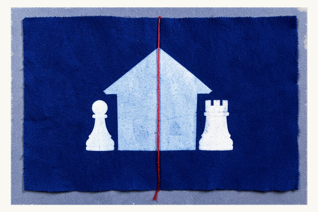 Ending co-ownership of a shared property: a house split in two by a vertical red thread, a chess pawn by one half and a rook by the other, cyanotype print