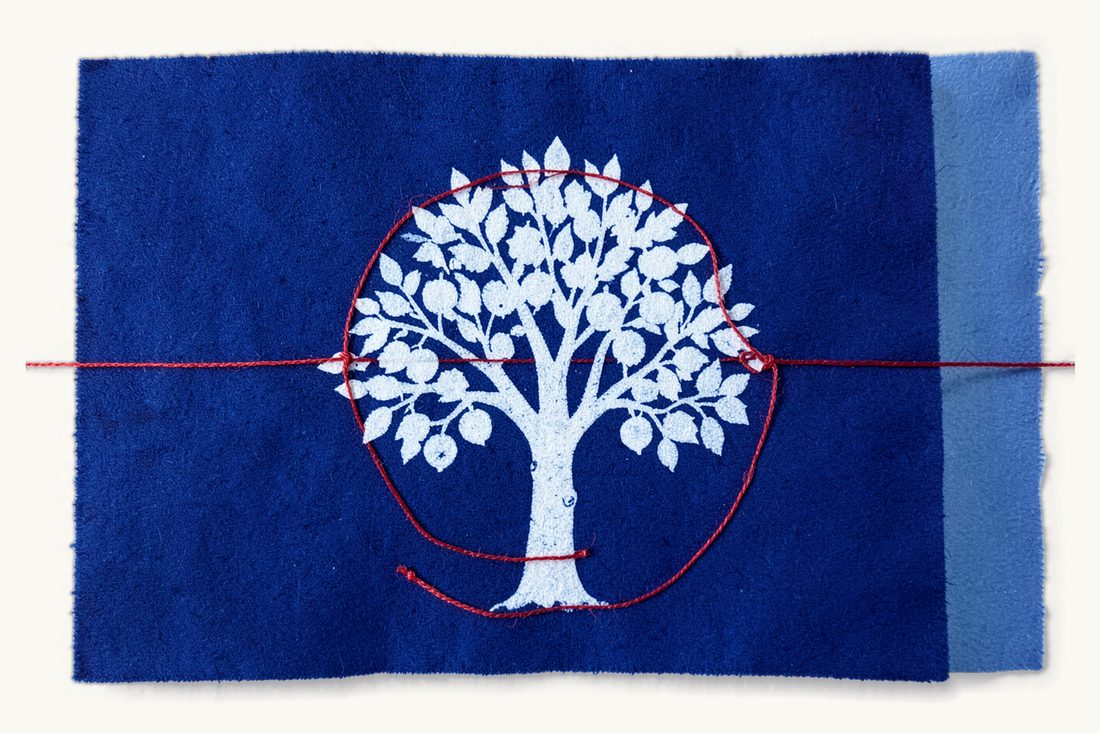Protecting geographical indications in Türkiye: a very large leafy tree with round fruits inside a closed loop of red thread, a small padlock hanging on the loop, cyanotype print