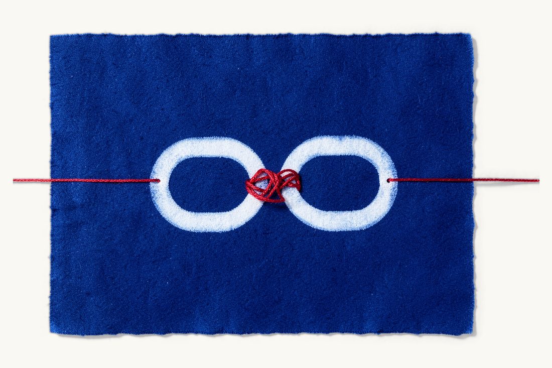 Reciprocity between your country and Türkiye: two large interlocking chain links, both whole, with a red thread wound around the point where they join, cyanotype print