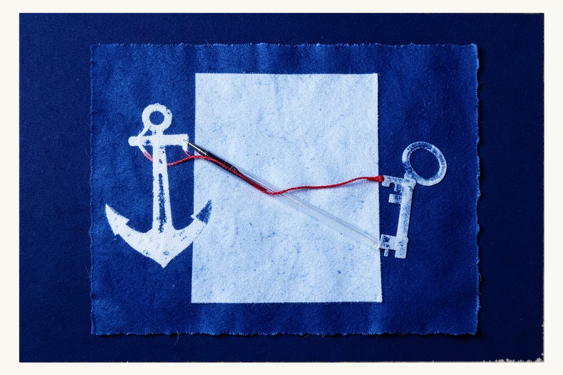 How ownership of a boat passes to a foreign buyer: a sheet of paper with a fountain pen between a ship's anchor and an old key, joined by a red thread, cyanotype print