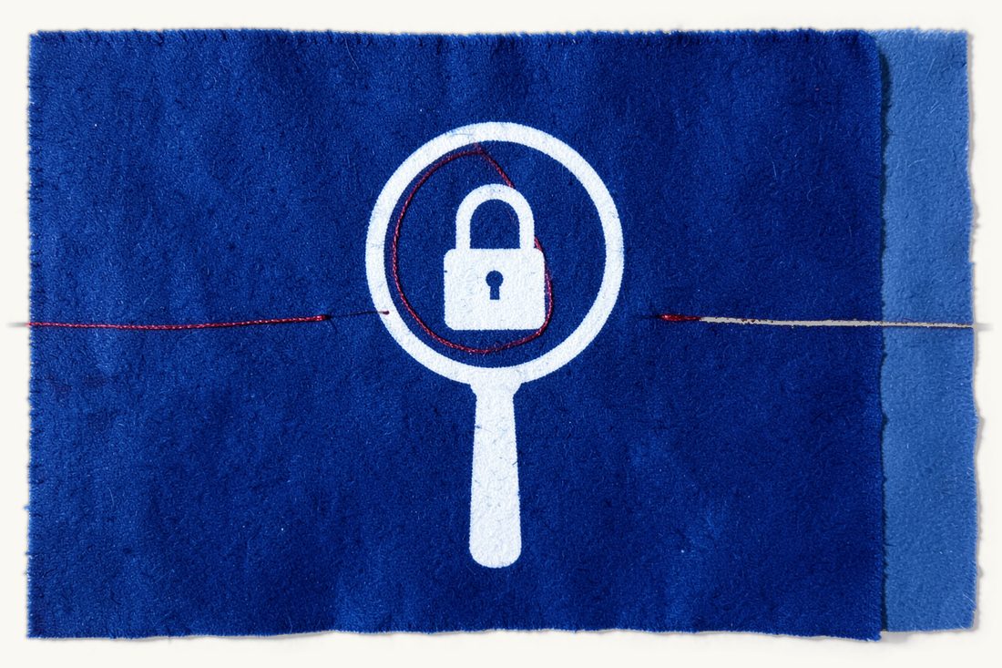 The Cybersecurity Presidency and product certification: a large magnifying glass over a closed padlock, a red thread drawn in a neat circle around the padlock, cyanotype print