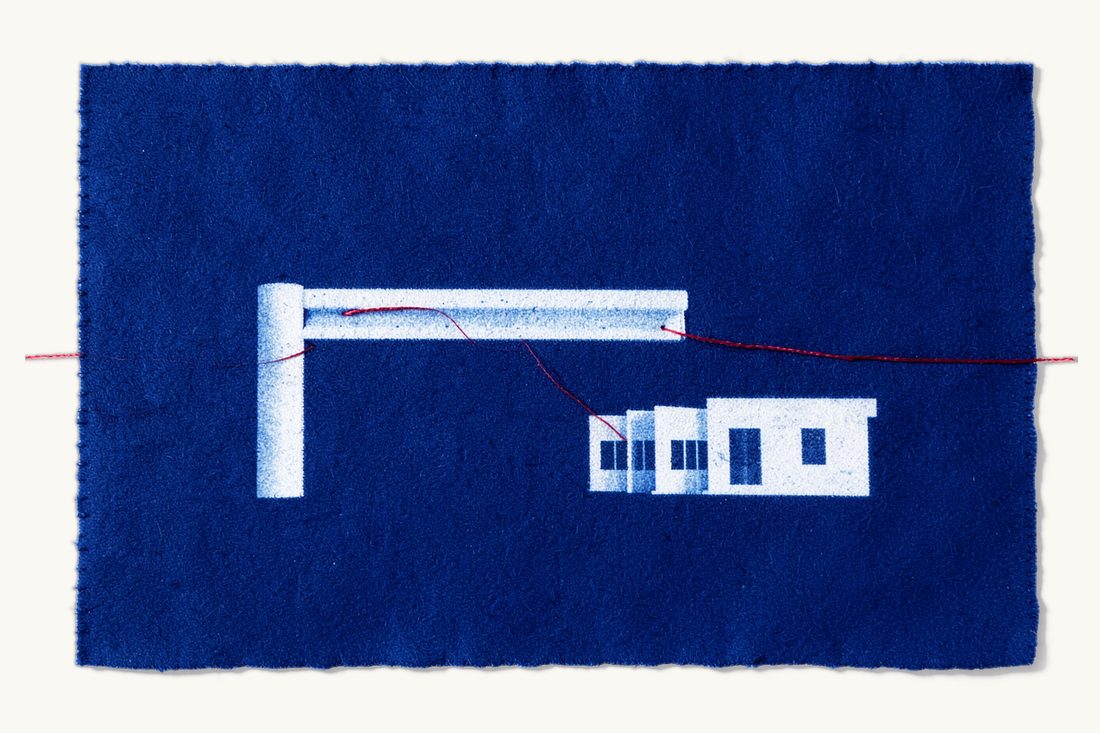 Merger control before closing: two joined office blocks waiting before a large lowered barrier arm, a red thread stopping at it, cyanotype print