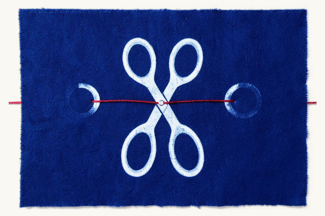 Divorce in Türkiye for foreigners and binational couples: large open scissors about to cut the red thread joining two small wedding rings, cyanotype print