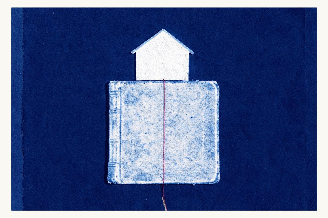 Checking the Turkish Land Registry (Tapu Sicili) record: a small house standing on a thick closed ledger-like book, the red thread running down its spine, cyanotype print