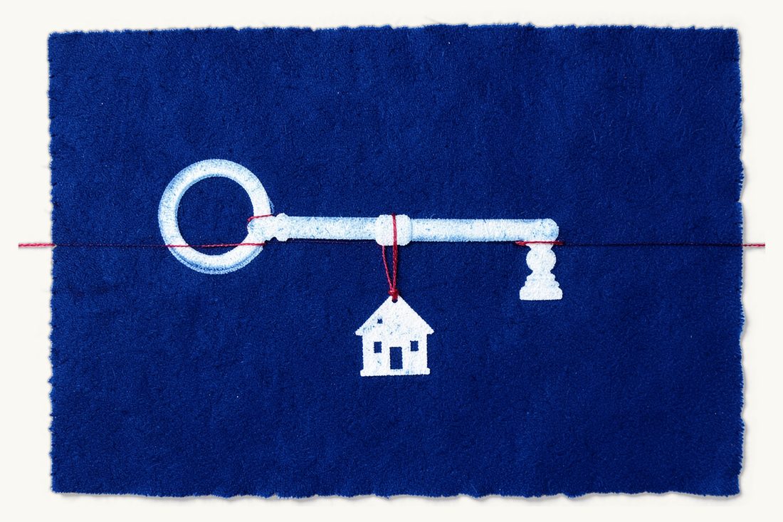 Buying property in Türkiye as a foreigner: a large old key with a small pitched-roof house hanging from its ring on the red thread like a keyring charm, a small pawn beside it, cyanotype print